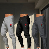 Pack de 3 Pantalones Deportivos para Hombre de Corte Holgado con Cintura Elástica y Cordón, Diseño con Dobladillo en el Tobillo - Joggers de Poliéster Resistente Ideales para Entrenamiento, Lavables a Máquina, Ropa de Gimnasio para Invierno (Paquete de 3