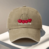 Gorra de béisbol ajustable del proyecto Nude - Ligera, lavable a mano, cierre de snapback, negra con diseño de texto rojo cereza y blanco, perfecta para viajes al aire libre y Halloween, accesorios de Halloween | Diseño juguetón | Gorra ligera